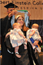 Bat-Sheva Maslow, with her twins, being hooded by her father Dr. Larry Lerner