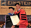 Dr. George Fruhman receiving Lifetime Service Award from Dean Allen M. Spiegel