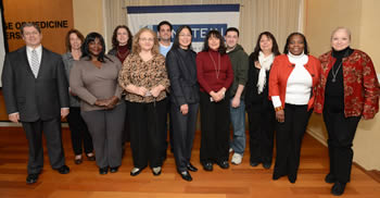 Ms. Chin (front row, center), pictured with Dr. Edward Burns, executive dean, and fellow employees being recognized for 15 years of service at Einstein, in December 2013