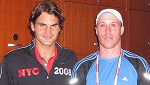 Scharf’s twin brother, Erik, with tennis champion Roger Federer