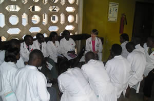 Dr. Meredith Hawkins meets with medical staff at Makerere University in Kampala, Uganda