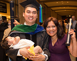  Dr. Jimenez celebrates his achievement with his mother, Maria, and infant daughter, Fabiola