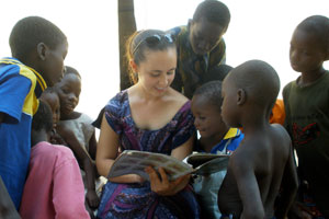 Ms. Jacobs’ cousin Kate, in Benin, with children from the local village.