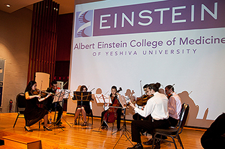 Student musicians performing violin concerto