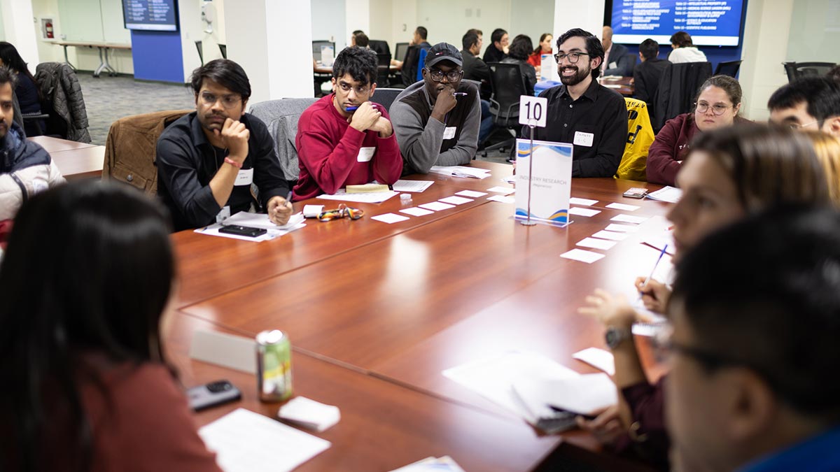 Students and postdocs hearing alumni discuss various career paths for Ph.D.s.