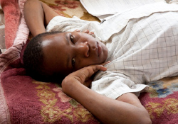 Isaac, a fifteen-year-old Ugandan orphan with type 1 diabetes who cannot afford insulin